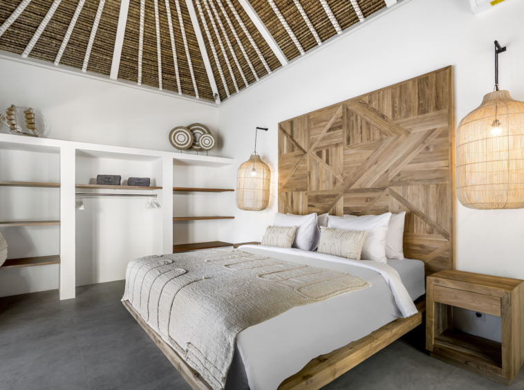 Only walking distance to Seminyak beach, enjoy the traditional modern interior bedroom at Cocotier Seminyak Villa