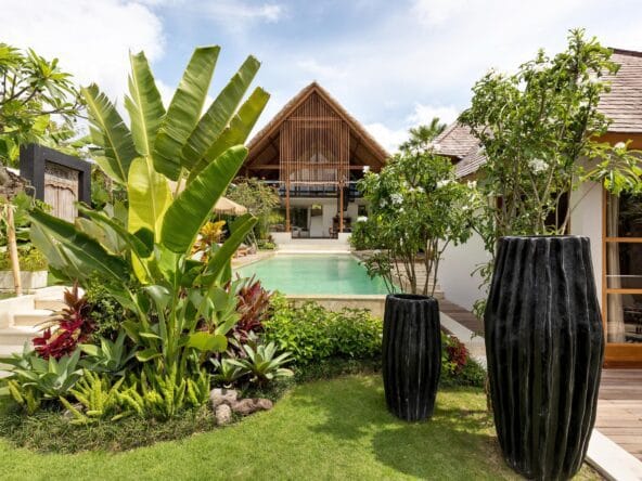 Vilal Chempaka in Canggu with a private pool that is surrounded by lush greenery